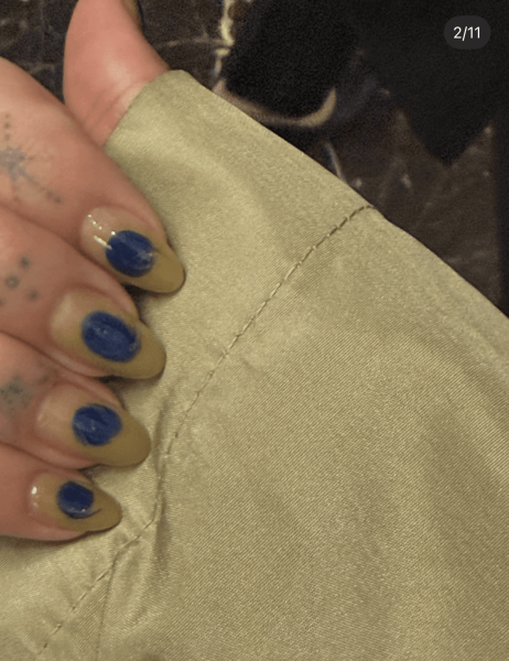 Closeup of Hailey Bieber's khaki and blue nail art